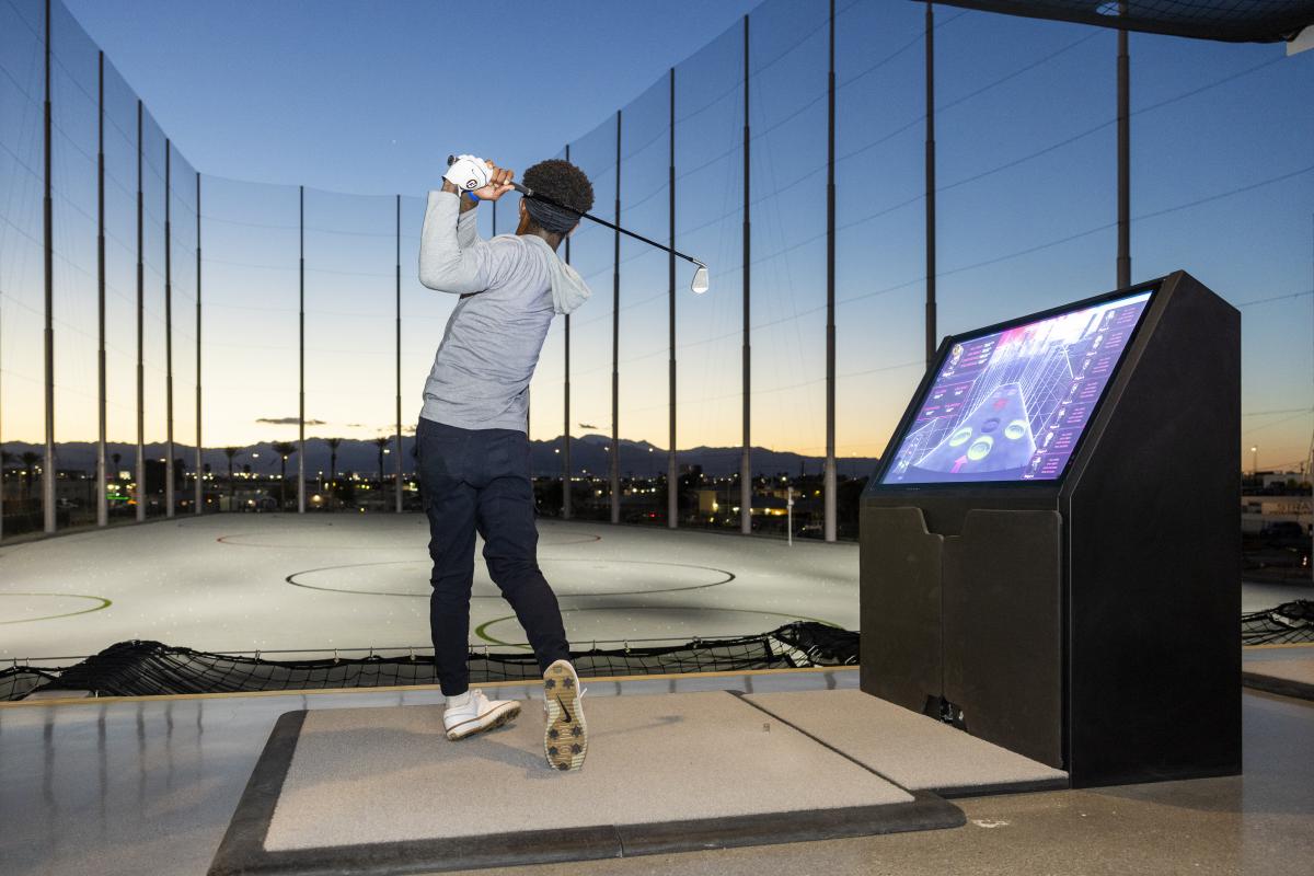 Man hitting a golf ball